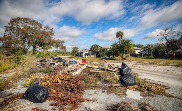 Garbage dumped at the Tymber Skan On the Lake Condominium complex, on Tuesday, January 28, 2025. The complex that has been plagued by public safety concerns and dilapidated structures for over twenty years. Only 8 of the original 49 buildings remain. The County has invested $3.5 million in efforts to try and stabilize the community and now believes intervention is necessary.(Ricardo Ramirez Buxeda/ Orlando Sentinel)