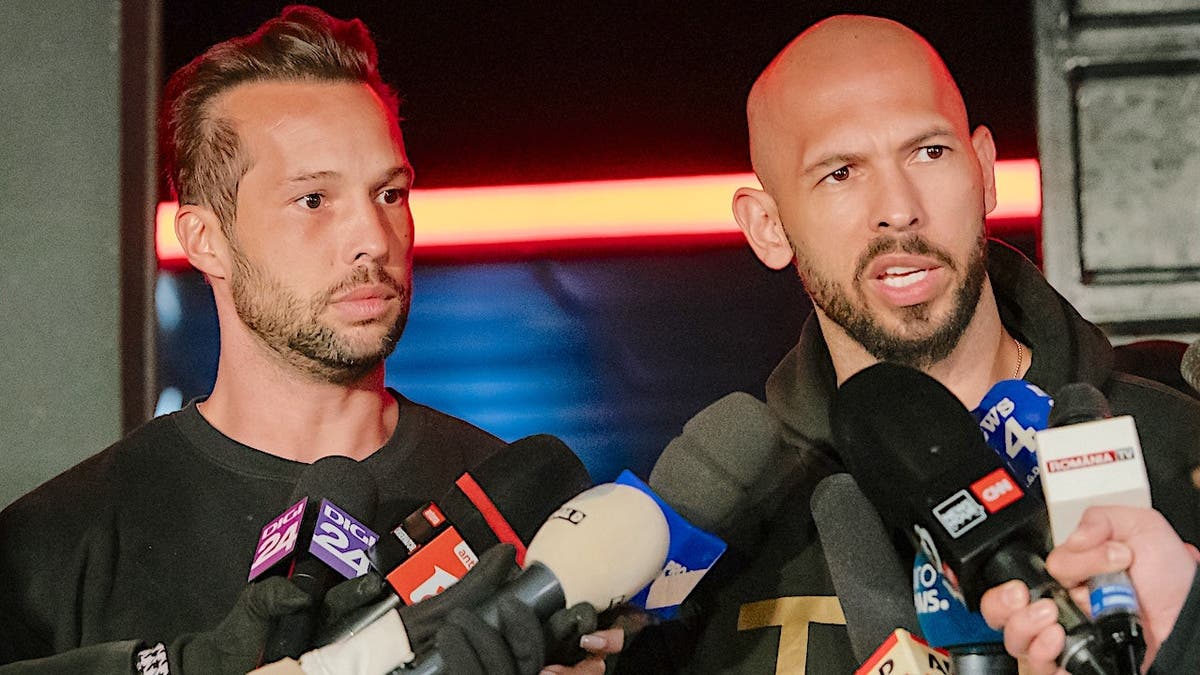 Andrew Tate and Tristan Tate talk to the media outside their residence in Bucharest, Romania.