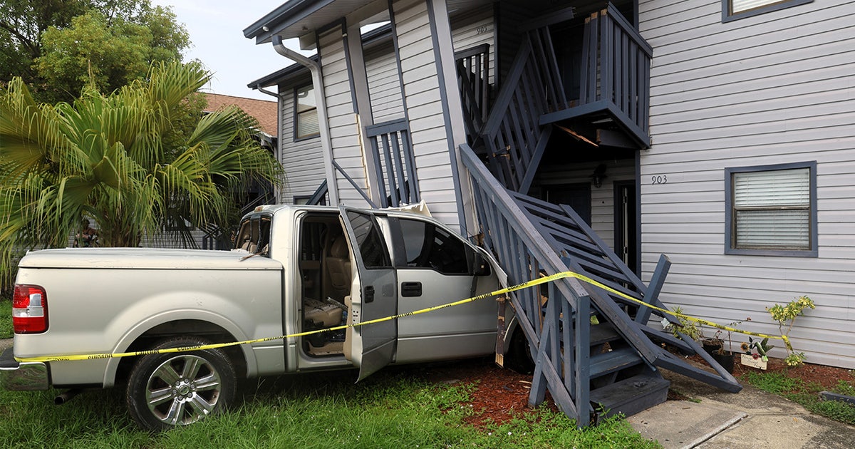 Two children hospitalized after car crashes into Hillsborough County apartment