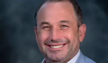 Portrait of Jake Gordon, CEO of Downtown Vision Inc.