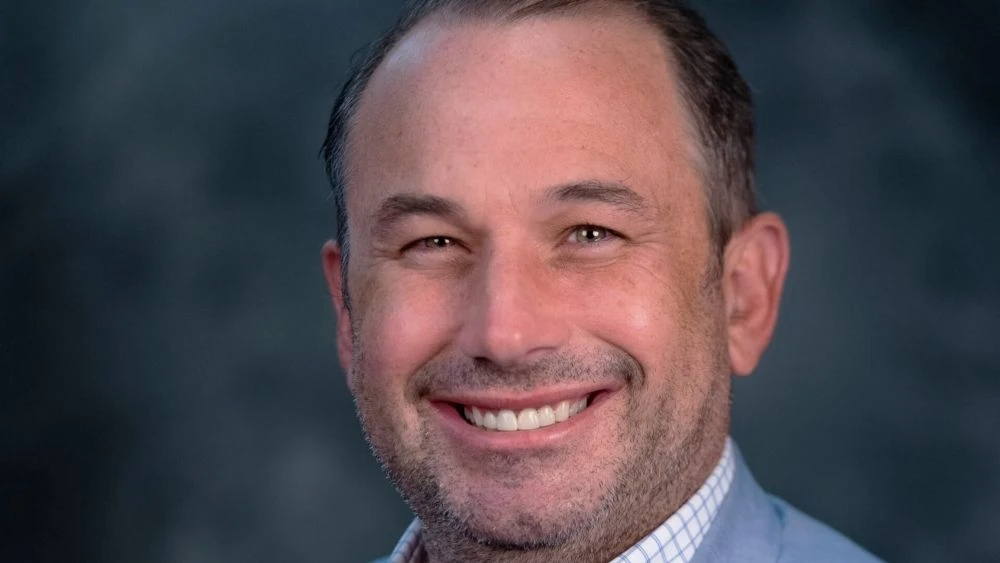 Portrait of Jake Gordon, CEO of Downtown Vision Inc.