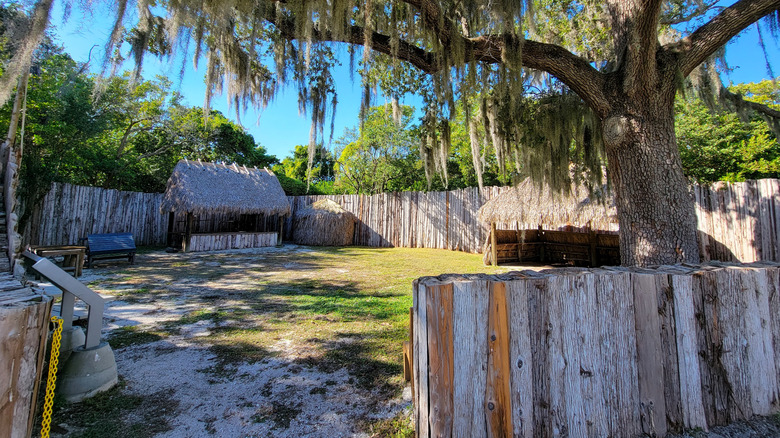 Traditional buildings at a recreated village within the De Soto National Memorial