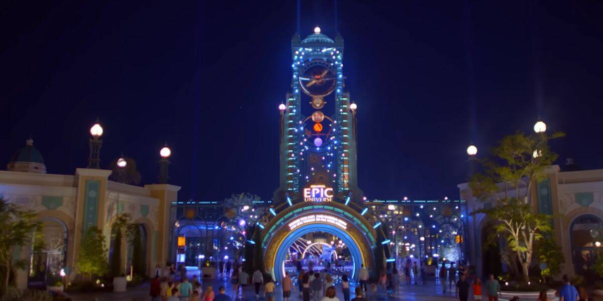 Universal's Epic Universe entrance lit up at night. Universal Nights Epic Universe