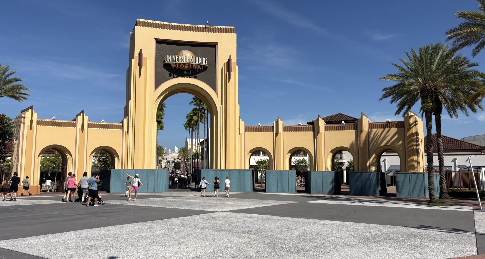 The construction walls we first spotted last week at the iconic archway have expanded at the front of Universal Studios Florida. While last week they comprised the first two entry points on the right side, they are now throughout except for the far left side.