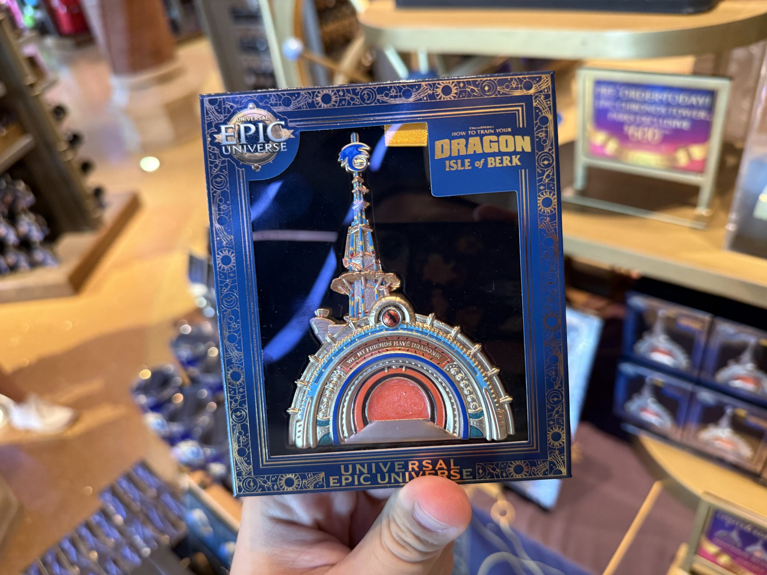 This portal pin is designed to look very similar to the real portal into Isle of Berk at Epic Universe. Featuring blues and oranges, it has