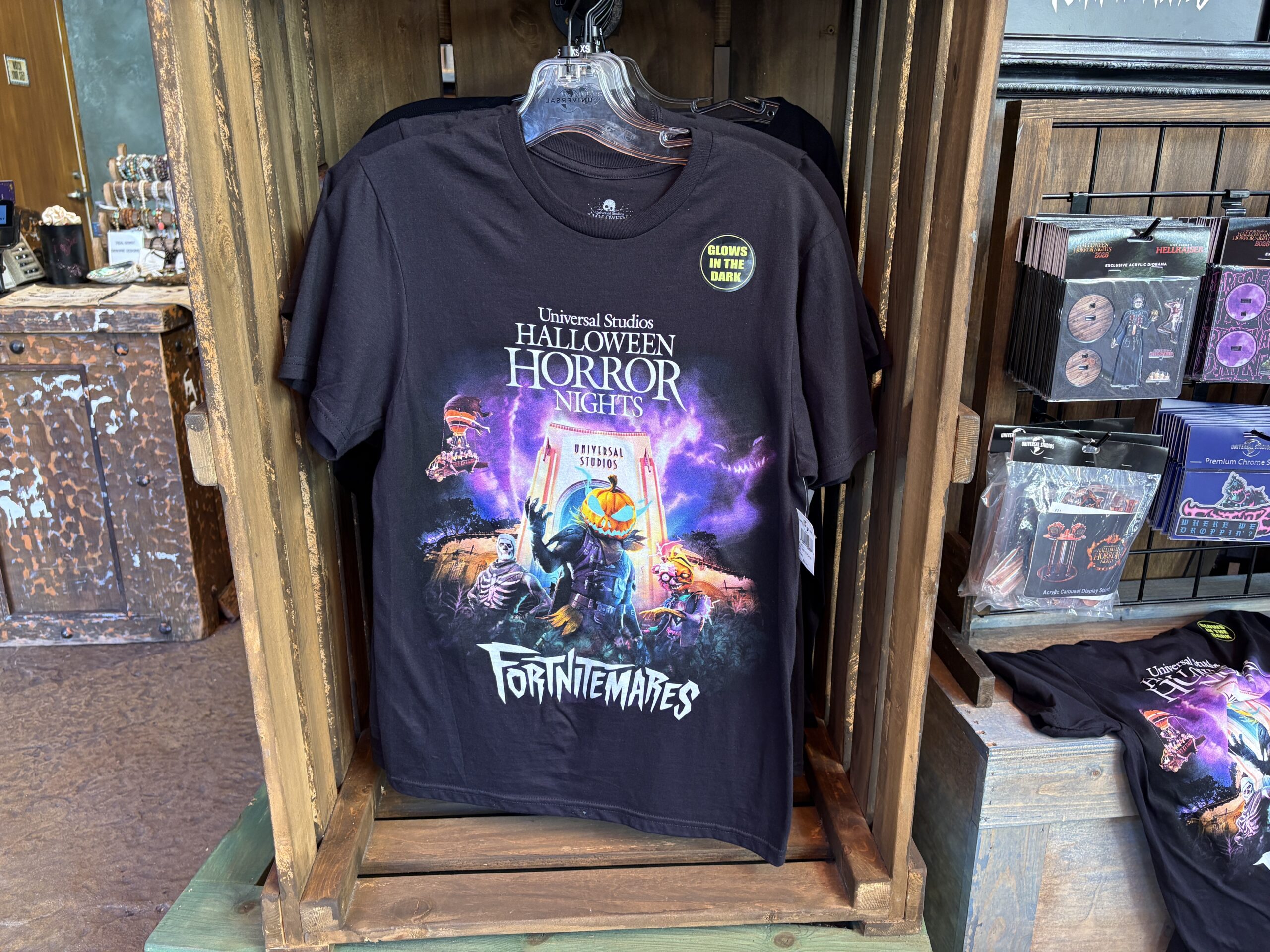 The black glow-in-the-dark tee features the FORTNITEMARES key art.