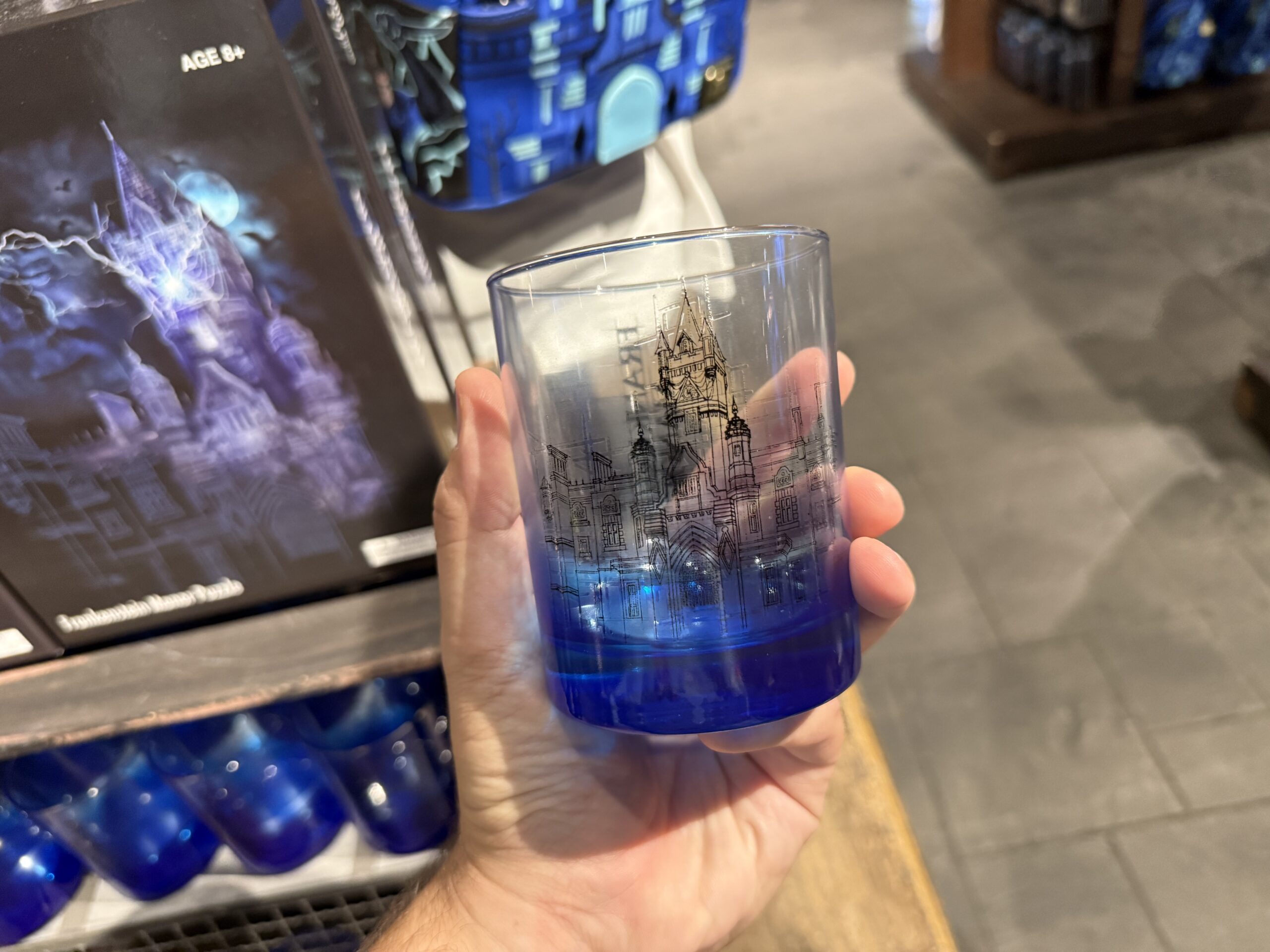 Blueprint art of the manor is in black on one side of this glass. On the reverse is "Frankenstein Manor." It has a blue ombré base. It's hand wash only.