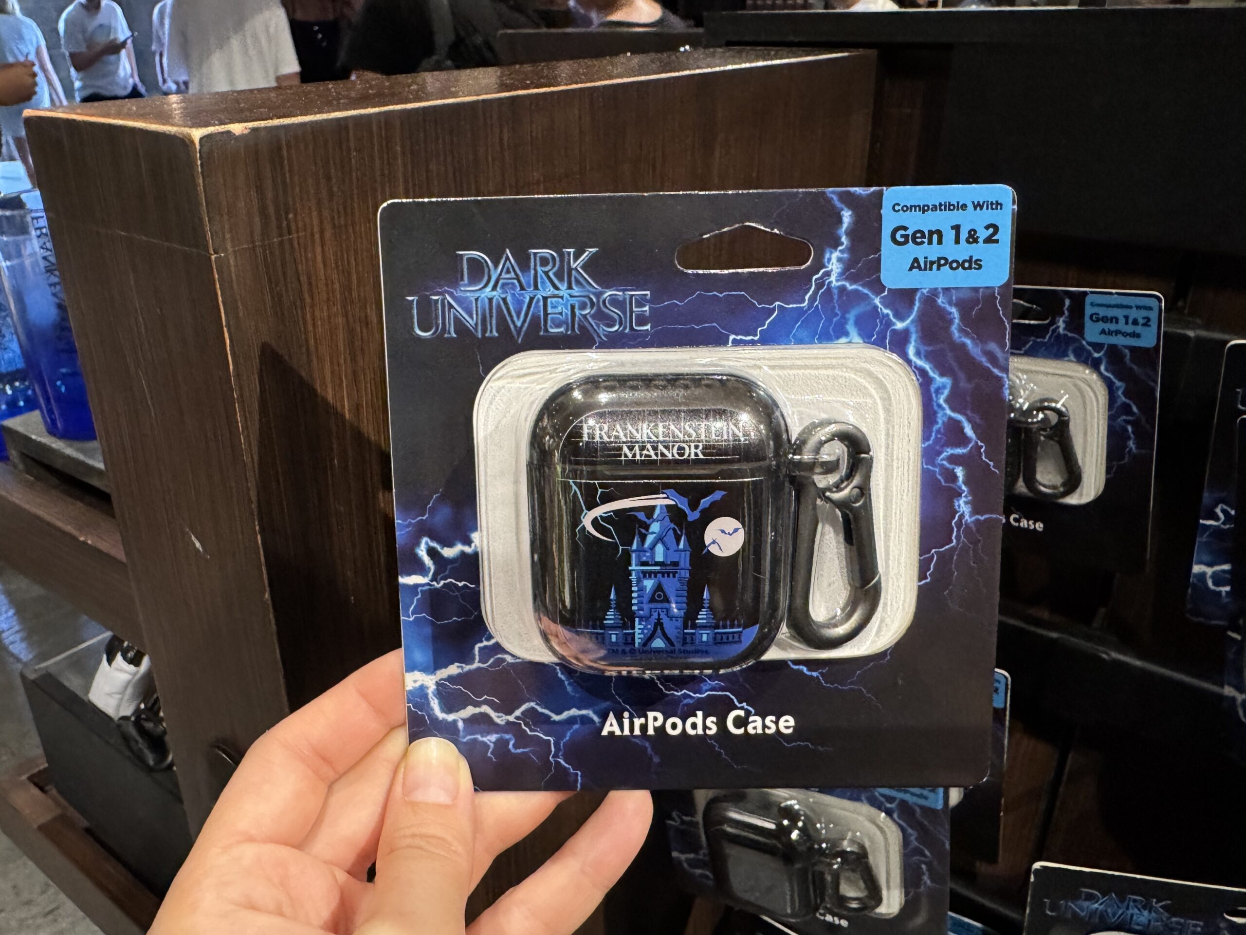 There are multiple versions of the AirPods case for Gen 1 and 2 AirPods Pro and Gen 4 AirPods. All three styles feature the towers of Frankenstein Manor in blue with bats flying across the sky and moon.