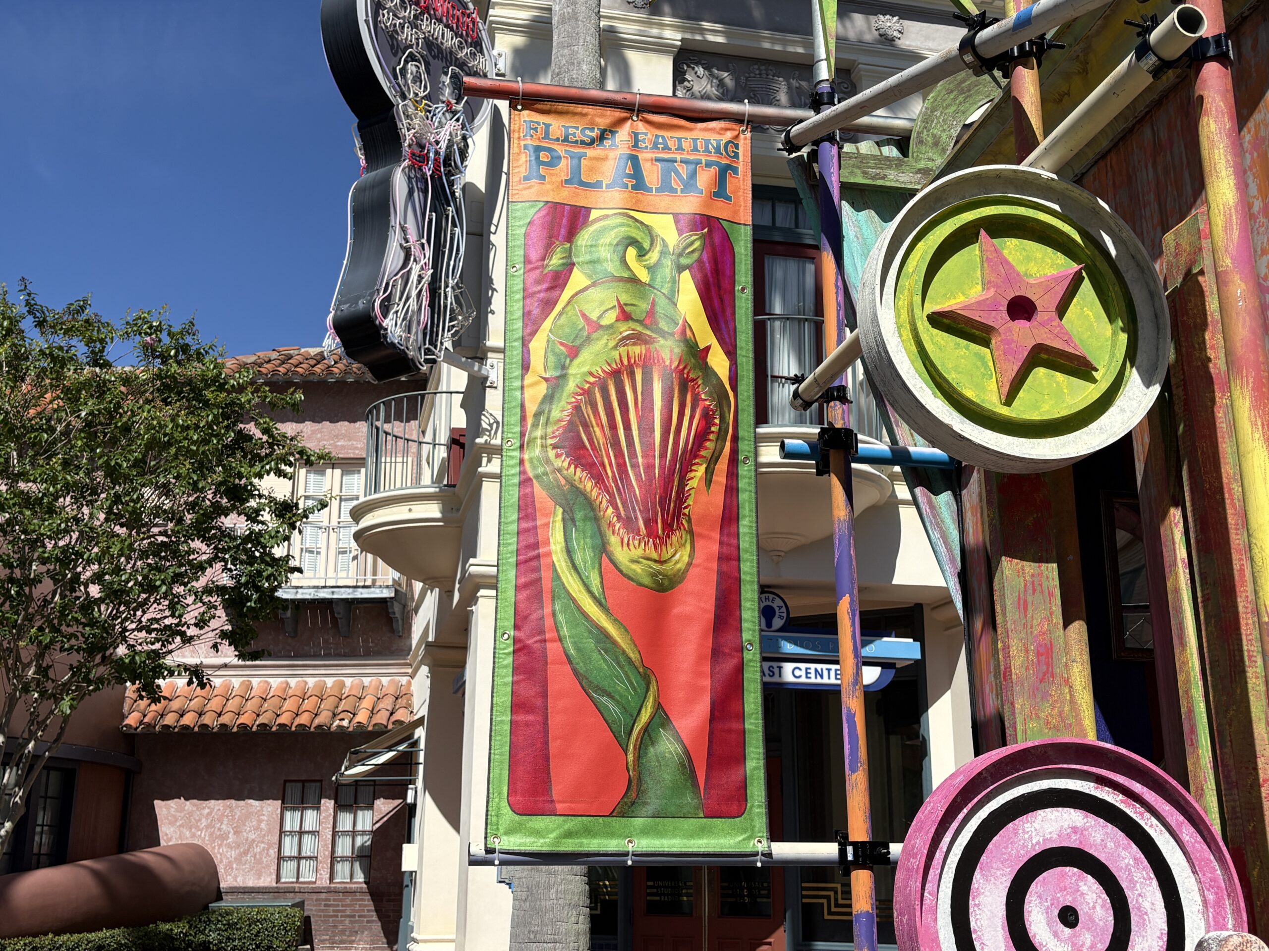 Made up of weathered but colorful walls, banners, and broken attractions, each set has a different theme. This one, as seen on the sign above the stage, is the