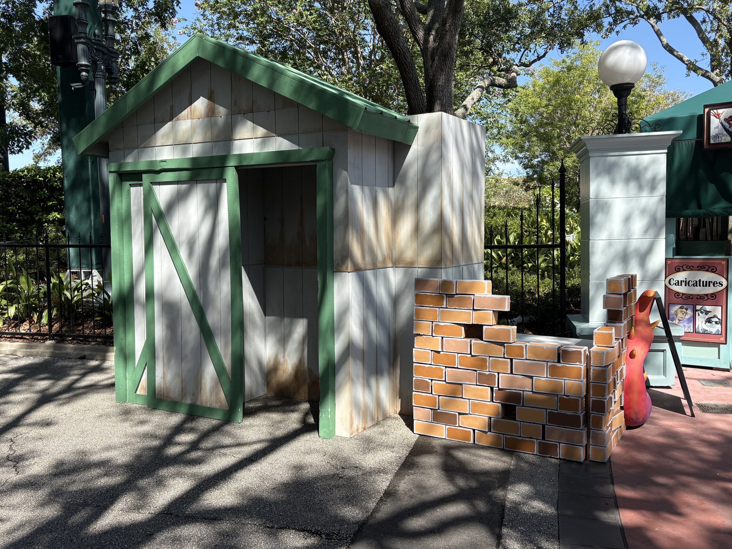 At the far end is an open shed where a scareactor will likely hide. Next to the shed is a partially-built brick wall.