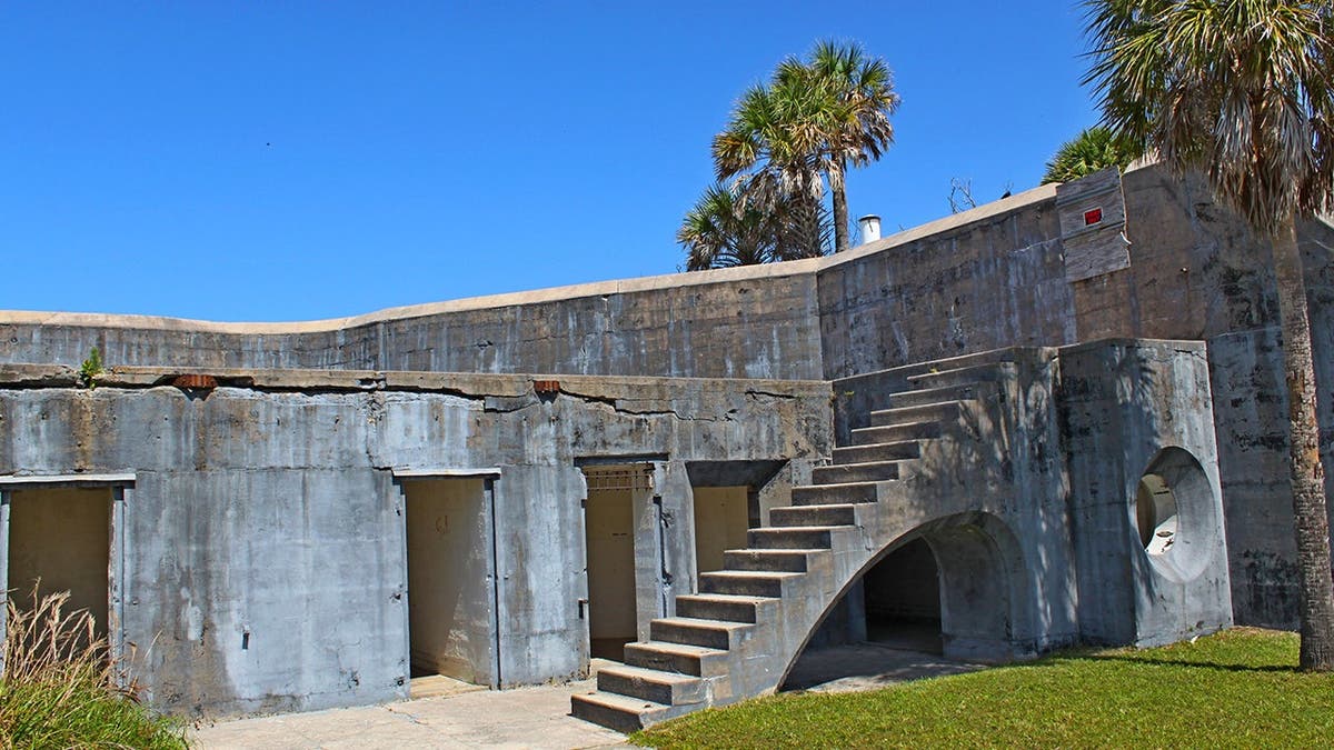 image shows ruins of steps, building