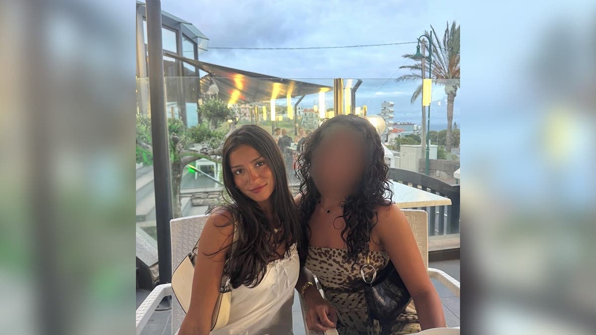 image shows victim posing for photo with friend