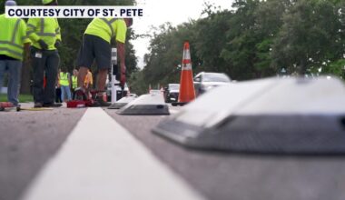 Crews place protective dividers along St. Petersburg bike lanes