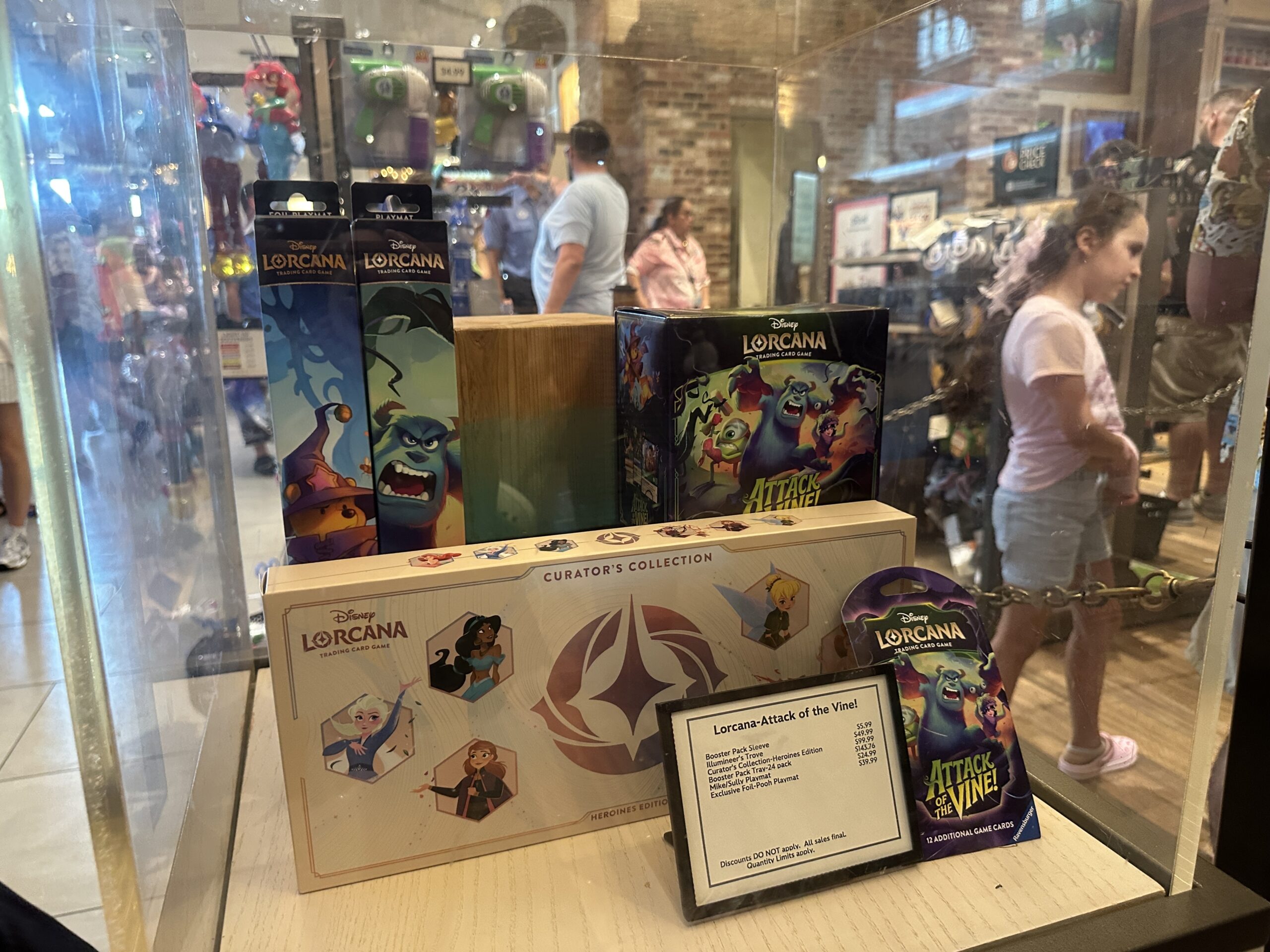 Disney Springs has a big crowd and long lines of guests trying to grab the Lorcana Curator’s Collection: Heroines Edition and the Disney Lorcana Attack of the Vine set, which are both releasing today, July 17.
