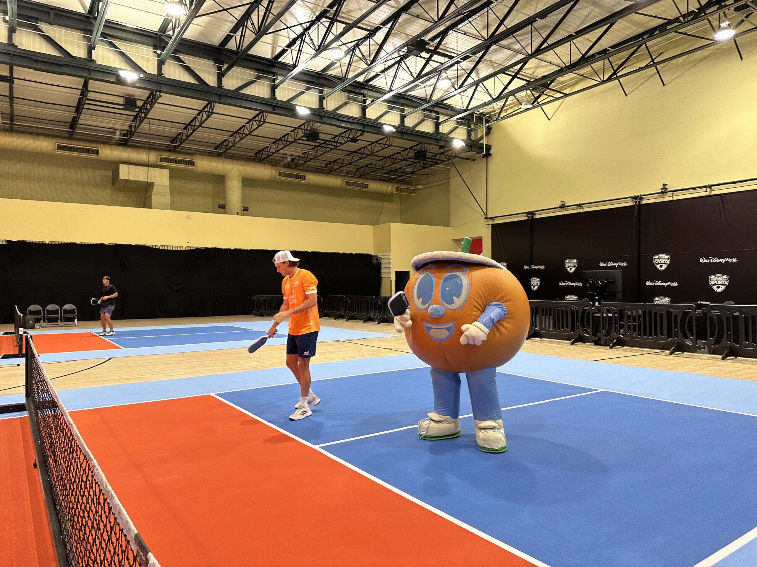 It wouldn't be a day on the court without Lil Squeezy, the Orlando Squeeze mascot. The pickleball-playing orange joined the players for a round.