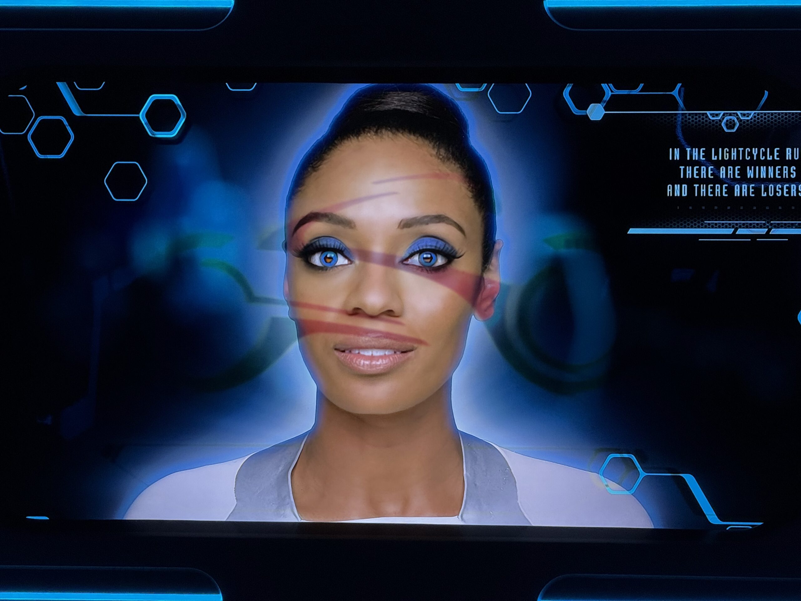 Most of the screens in the TRON Lightcycle Run queue at Magic Kingdom now have images of lightcycles burnt into them.