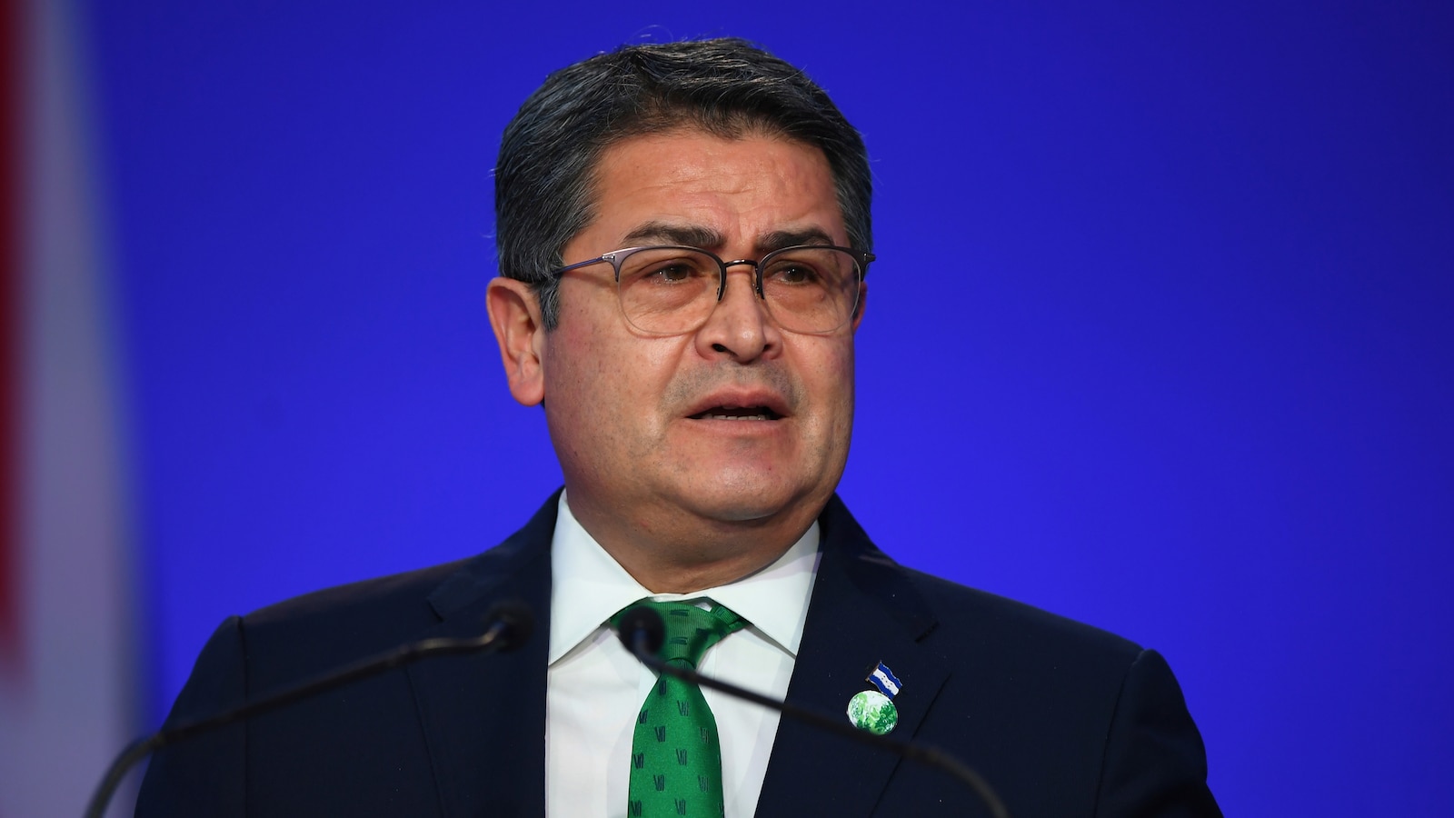 Former President Juan Orlando Hernández returns to Honduras after arrest warrant suspended