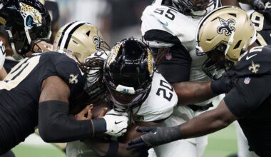 Aug 15, 2026; New Orleans, Louisiana, USA; New Orleans Saints linebacker Kaden Elliss (55) and defensive lineman Jay'viar Suggs (62) tackle Jacksonville Jaguars running back Deejay Dallas (20) during the first quarter at Caesars Superdome.