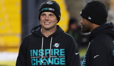 Dec 15, 2025; Pittsburgh, Pennsylvania, USA;  Miami Dolphins quarterbacks Zach Wilson (0), left, and Tua Tagovailoa (1), right, talk on the field before the game against the Pittsburgh Steelers at Acrisure Stadium.