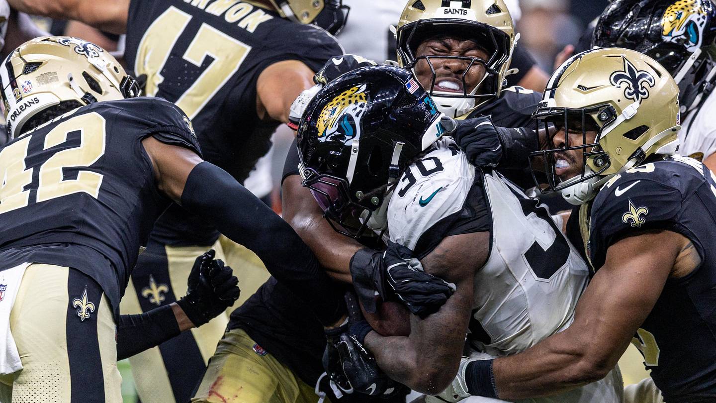 Aug 15, 2026; New Orleans, Louisiana, USA;  Jacksonville Jaguars running back J'mari Taylor (30) is tackled by New Orleans Saints cornerback Mike Reid (42) during the second half at Caesars Superdome. Mandatory Credit: Stephen Lew-Imagn Images