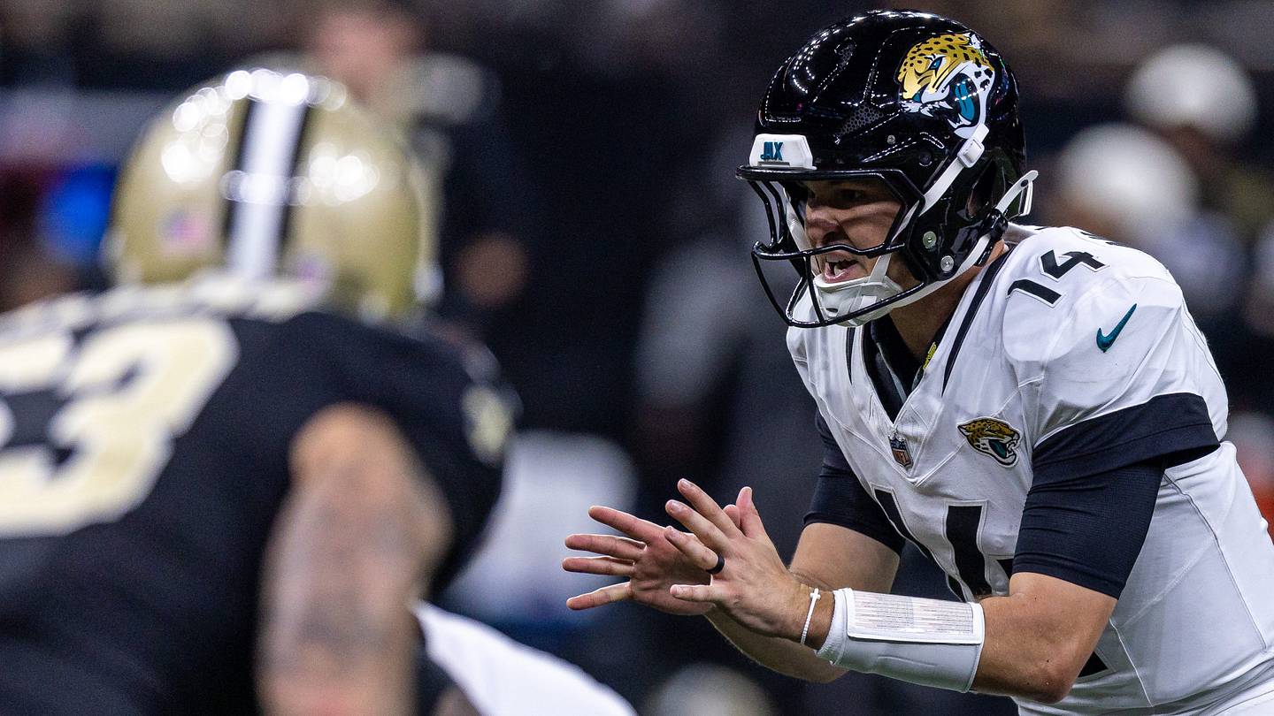 Aug 15, 2026; New Orleans, Louisiana, USA;  Jacksonville Jaguars quarterback Nick Mullens (14) calls for the ball against New Orleans Saints during the first half at Caesars Superdome.