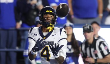 Oct 3, 2025; Provo, Utah, USA; West Virginia Mountaineers wide receiver Cam Vaughn (4) makes a catch for a touchdown against the Brigham Young Cougars during the fourth quarter at LaVell Edwards Stadium. Mandatory Credit: Rob Gray-Imagn Images