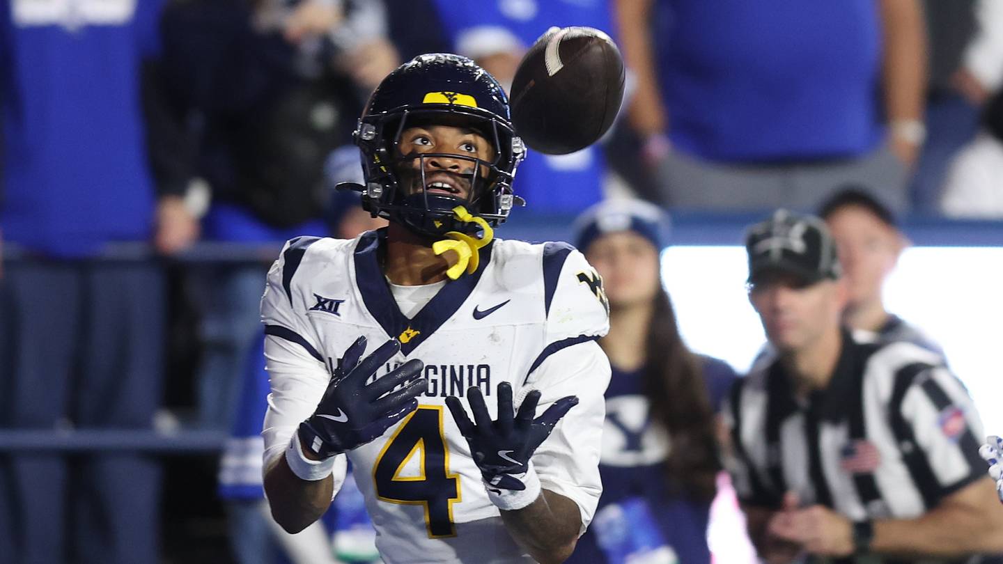 Oct 3, 2025; Provo, Utah, USA; West Virginia Mountaineers wide receiver Cam Vaughn (4) makes a catch for a touchdown against the Brigham Young Cougars during the fourth quarter at LaVell Edwards Stadium. Mandatory Credit: Rob Gray-Imagn Images