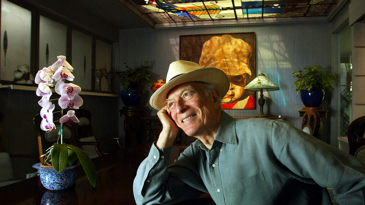 Kenneth Treister, a notable Miami architect, sculptor and photographer passed away on Friday, Aug. 28. He is pictured here in 2003 in his dining room at his former home in Coconut Grove, where he designed the stained-glass ceiling, the art on the walls, the furniture, and even grew the plants.