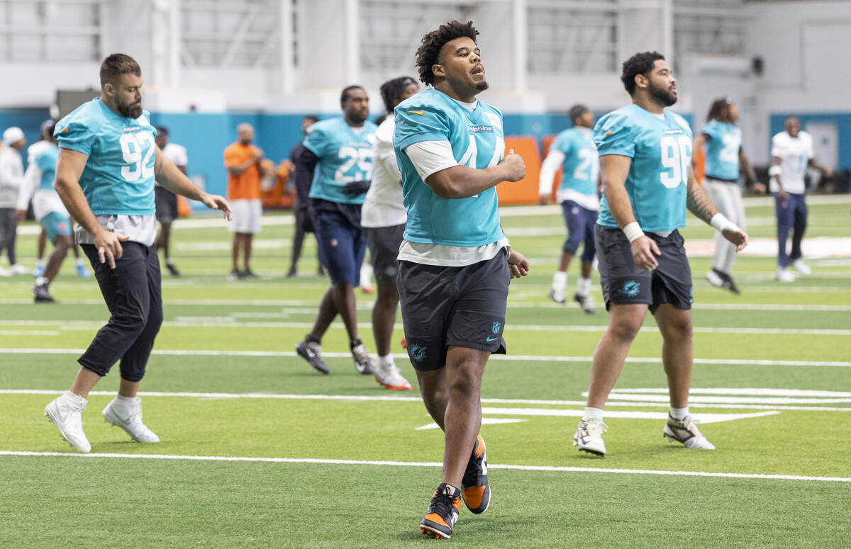 Miami Dolphins linebacker Chop Robinson (44) stretches during a team practice session at the Baptist Health Training Complex on Tuesday, June 9, 2026, in Miami Gardens, Fla.