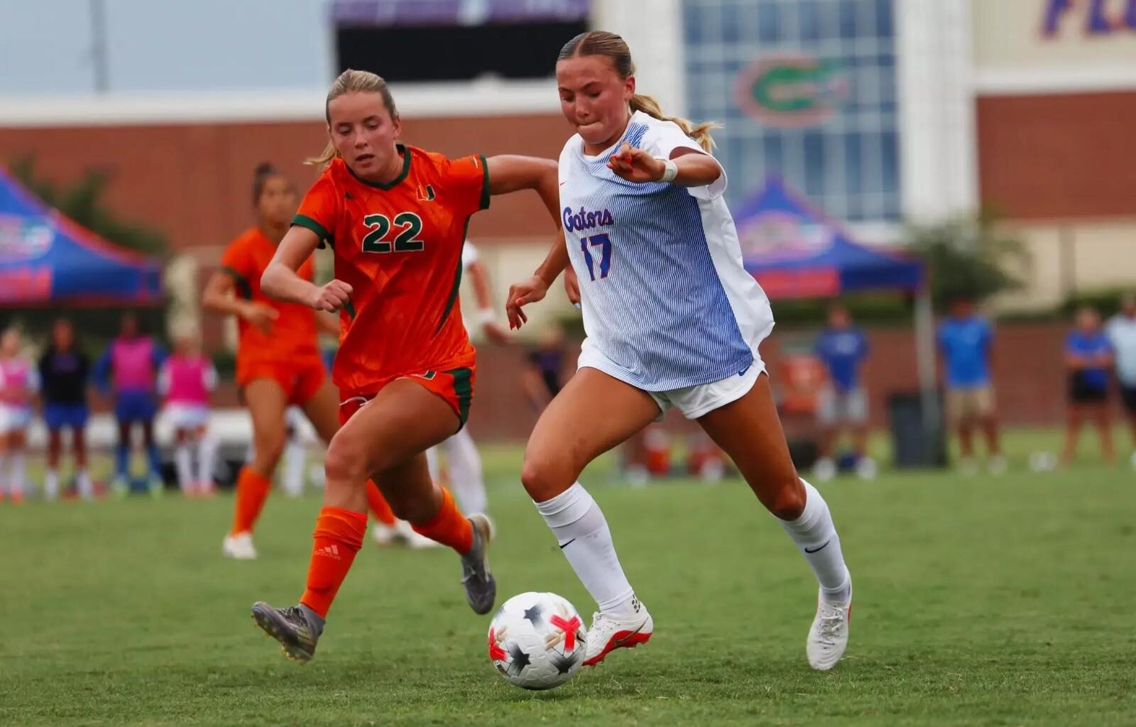 2026 University of Florida soccer team (front row from left): Iori Watanabe, Carlota Martins, Ella Petersen, Kelsey Smith, Emma Duval, Tatum Borman, Zoe Main, Sophia Sindelar, Adia Symmonds. Second row: Katie Johnston, Addison Dean, Lael Hill, Norah Abbott, Montelene Dymond, Kyra Taylor, Addy Hess, Nylah Norris, Mia Gray, Courtney Hogan. Back row: Assistant Coach Kerri Hanks Petersen, Associate Head Coach Jonathan Garbar, Charlotte Grim, Hannah Jibril, Conamora Ndana, Skye Barnes, Jayden Emmanuel, Paloma Peña, Paris Bice, Lena Bailey, Avery Upton, Breahn Fisher, Head Coach Nick Zimmerman, Assistant Coach David Styles