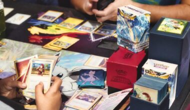 photo of two people playing with Pokemon trading cards on a table