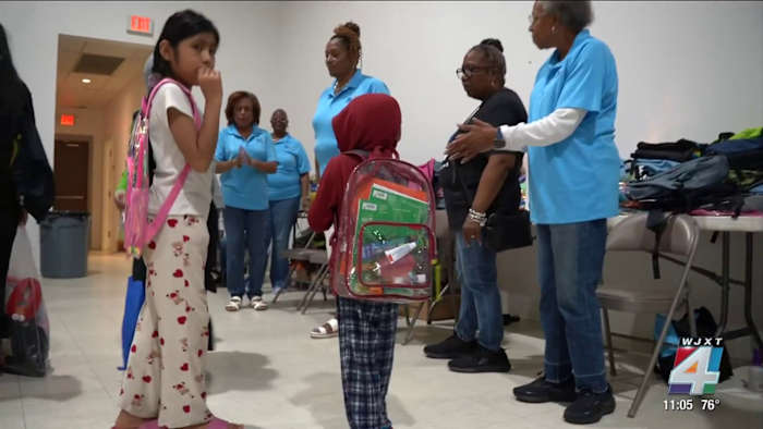 Free backpacks, haircuts draw nearly 500 families to Jacksonville church’s back-to-school giveaway