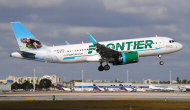 A Frontier airlines plane in flight.