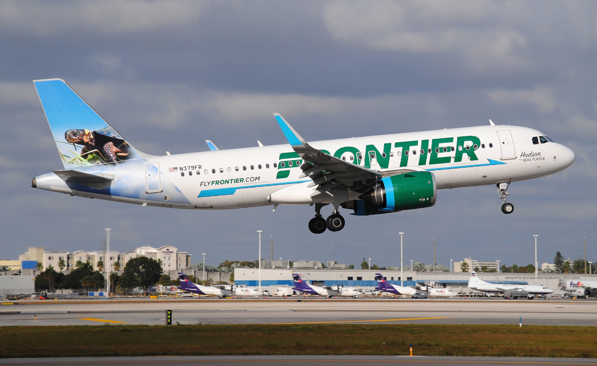 A Frontier airlines plane in flight.