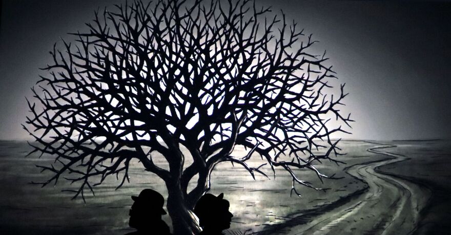 On a barren road beside a single, withering tree, two men wait for a mysterious figure who never arrives.
