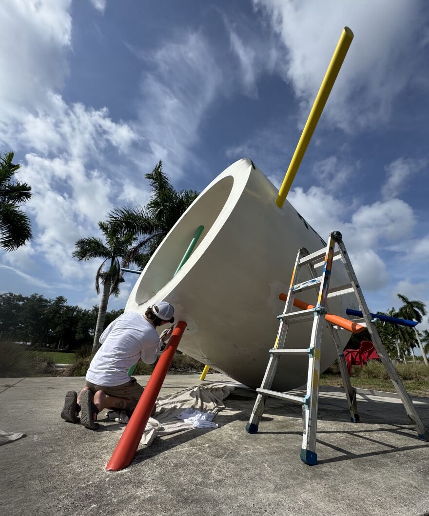 Jason 'Sandman' Sanders at work on 'You Are Here' sculpture.