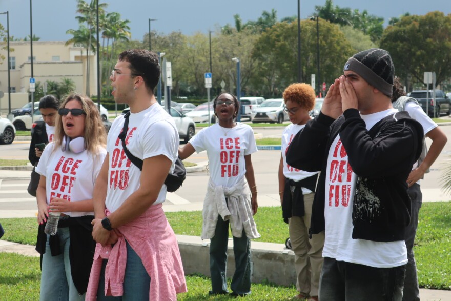 A group of students with shirts that read 'ICE OFF FIU' are shouting during a protest that takes place outside.