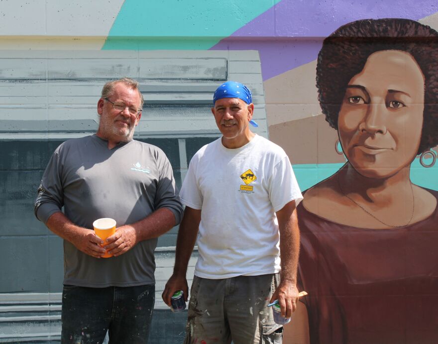 Ruocco with fellow Buck's Backyard muralist Eric Schlake on site at McCollum Hall.