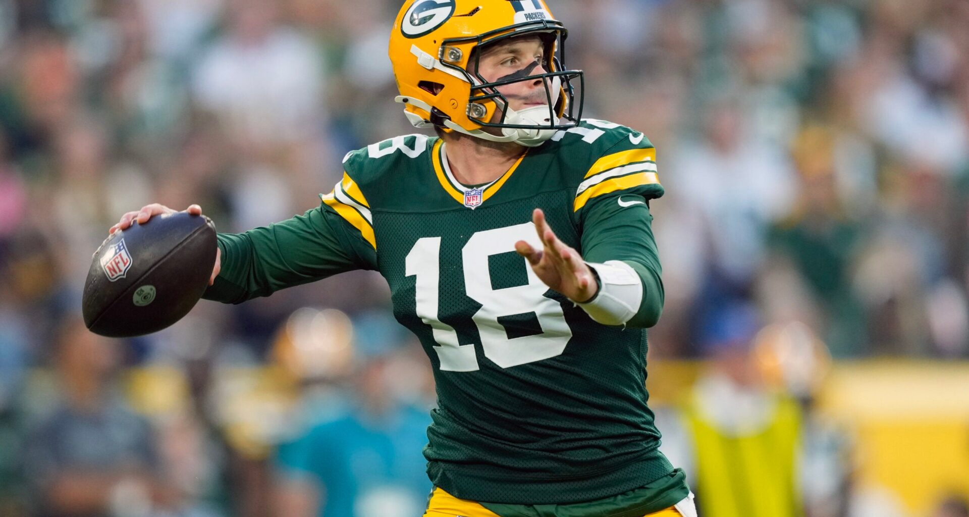 Aug 28, 2026; Green Bay, Wisconsin, USA; Green Bay Packers quarterback Kyle McCord (18) throws a pass during the first quarter against the Arizona Cardinals at Lambeau Field.