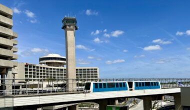 Tampa International Airport’s existing air traffic control tower rises behind an Airside shuttle and the Tampa Airport Marriott.