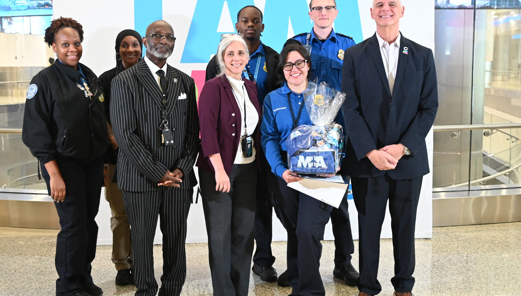 August 2026 Employee of the Month:  TSA Officer assists mom and young child who lost their travel documents