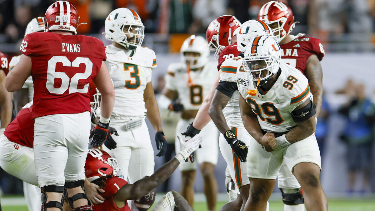 Miami Hurricanes defensive lineman Ahmad Moten Sr. (99) reacts after tackling Indiana Hoosiers running back Roman Hemby (1) in the first half of the College Football Playoff National Championship Game at Hard Rock Stadium in Miami Gardens, Florida, on Monday, January 19, 2026.