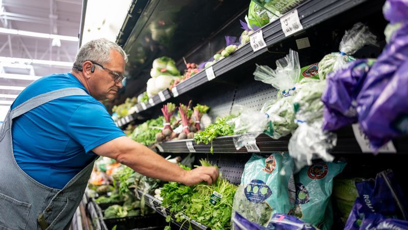 AUSTIN, TEXAS - JULY 23: A customer shops for cilantro at a Walmart Supercenter on July 23, 2026 in Austin, Texas. The cyclosporiasis outbreak, an intestinal illness caused by the microscopic parasite Cyclospora cayetanensis, has spread across multiple states and remains under investigation by federal health officials after the first known illness onset was reported in early May. (Photo by Brandon Bell/Getty Images)