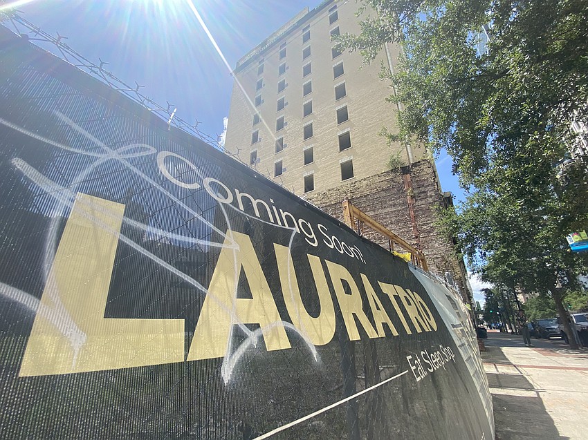 A portion of the Laura Street Trio is shown July 3, 2024, from near Adams and Laura streets in Downtown Jacksonville. The Bisbee Building, at left, and Florida Life Insurance Building combine with the Florida National Bank building at Forsyth and Laura streets to make up the Laura Street Trio. The buildings have been vacant and exposed to the elements for more than 30 years.