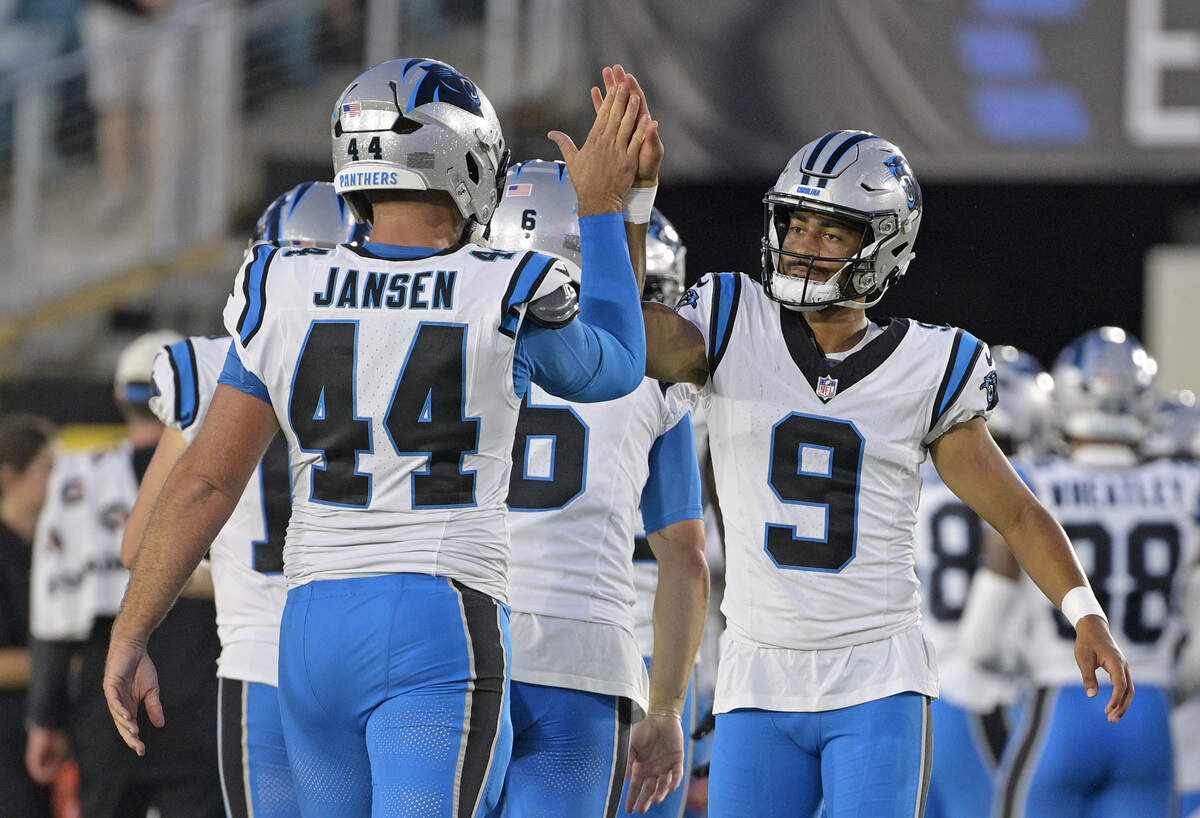 Carolina Panthers quarterback Bryce Young (9) celebrates with long snapper JJ Jansen during the first quarter of the preseason game against the Jacksonville Jaguars at EverBank Stadium in Jacksonville, Fla., on Friday, Aug. 21, 2026.