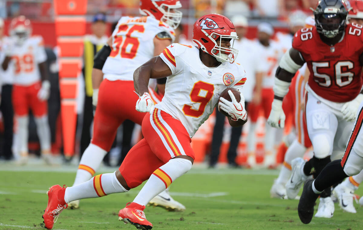 Kansas City Chiefs running back Kenneth Walker III (No. 9) carries the ball against the Tampa Bay Buccaneers during a preseason NFL game at Raymond James Stadium in Tampa on Saturday, Aug. 22, 2026.