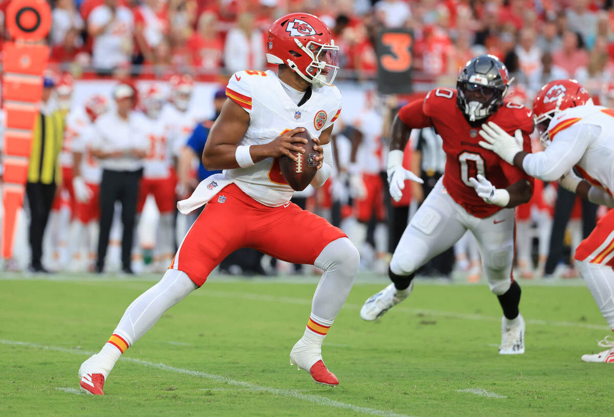 Kansas City Chiefs quarterback Justin Fields (6) drops back against the Tampa Bay Buccaneers during a preseason NFL game at Raymond James Stadium in Tampa on Saturday, Aug. 22, 2026.