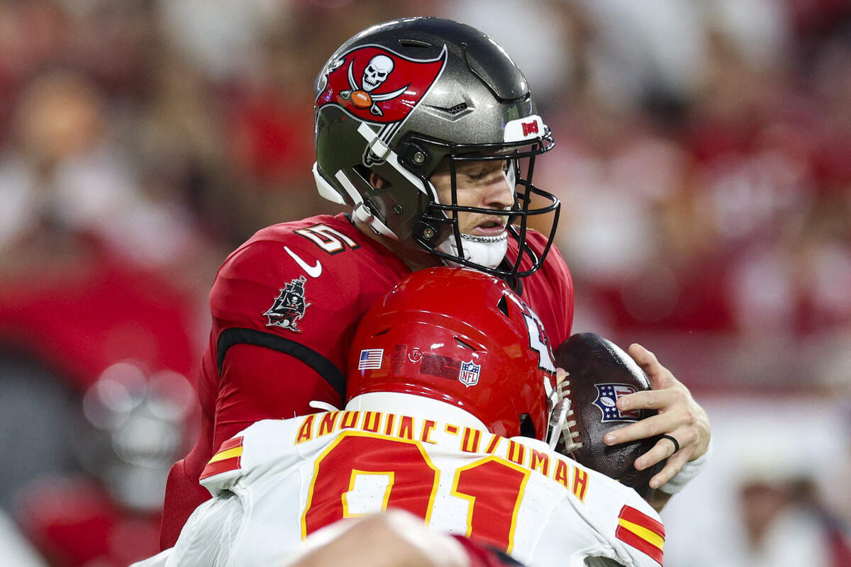 Kansas City Chiefs defensive end Felix Anudike-Uzomah (91) sacks Tampa Bay Buccaneers quarterback Jake Browning (5) during the first quarter of a preseason NFL game at Raymond James Stadium in Tampa on Saturday, Aug. 22, 2026.