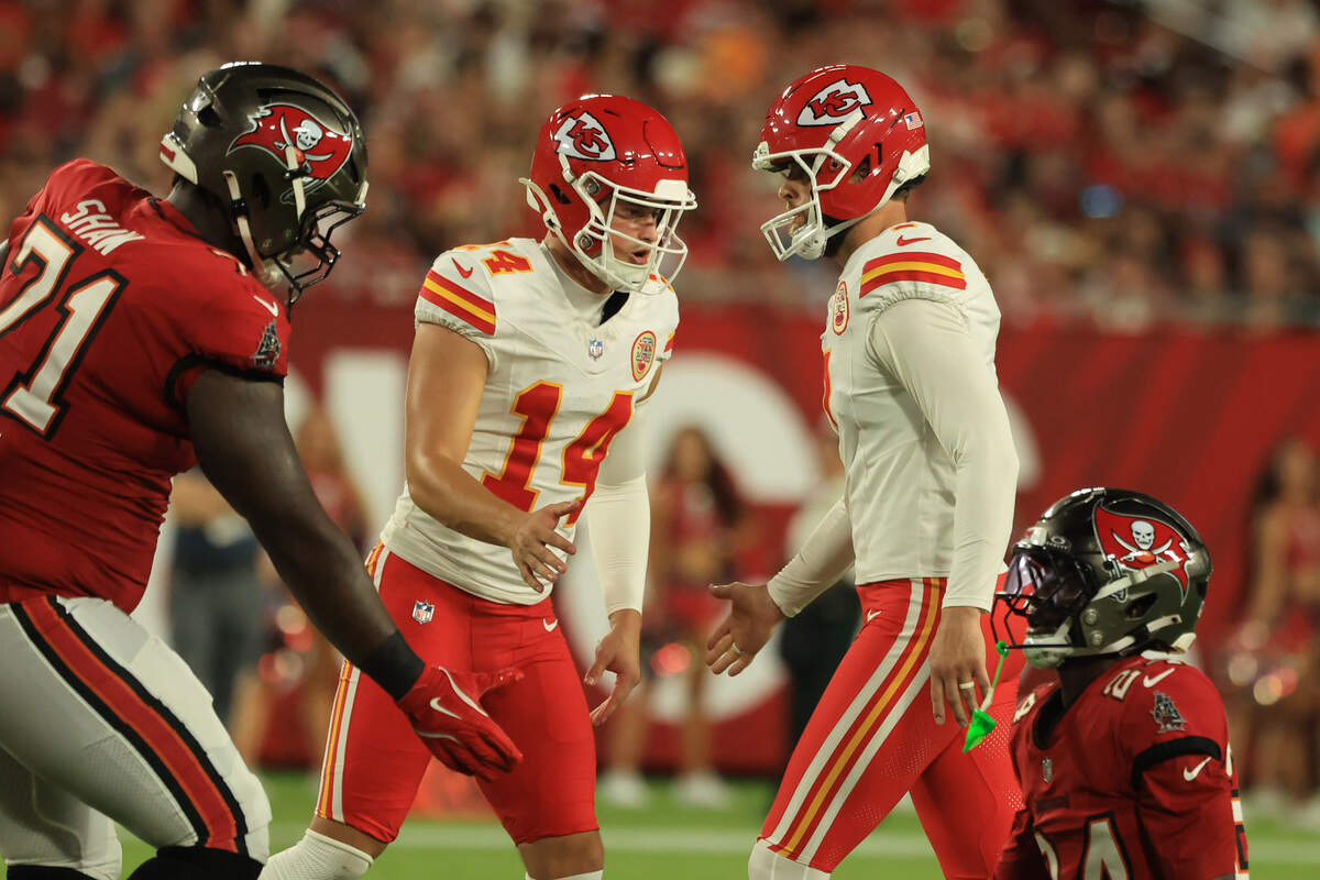 Kansas City Chiefs placekicker Harrison Butker (7) celebrates with punter Matt Araiza (14) after kicking a 69-yard field goal at the end of the first half of a preseason NFL game against the Tampa Bay Buccaneers at Raymond James Stadium in Tampa on Saturday, Aug. 22, 2026.