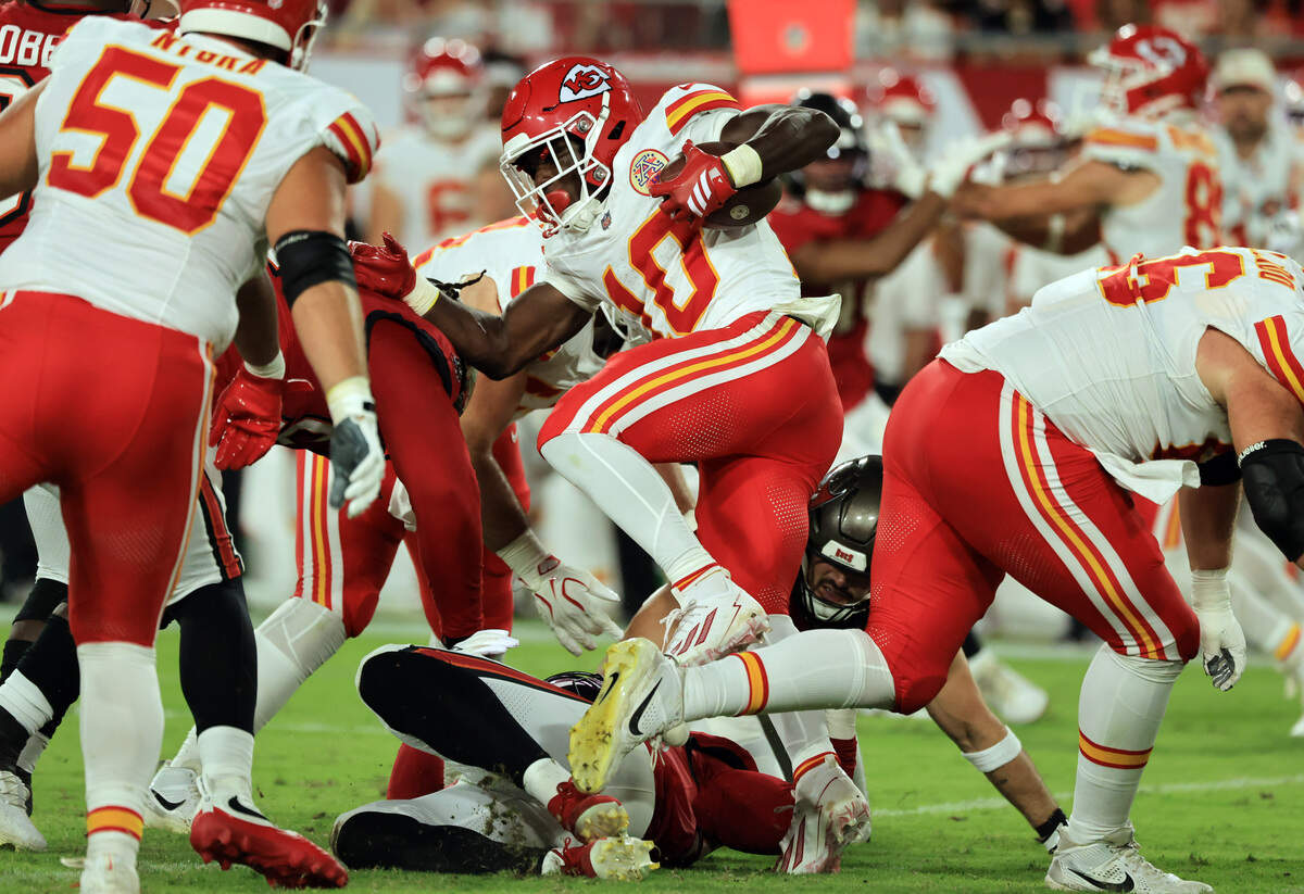 Kansas City Chiefs running back Emmett Johnson (10) runs against the Tampa Bay Buccaneers during a preseason NFL game at Raymond James Stadium in Tampa on Saturday, Aug. 22, 2026.
